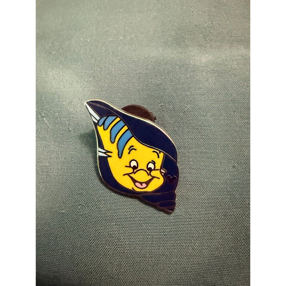 Disney pin featuring Flounder from The Little Mermaid